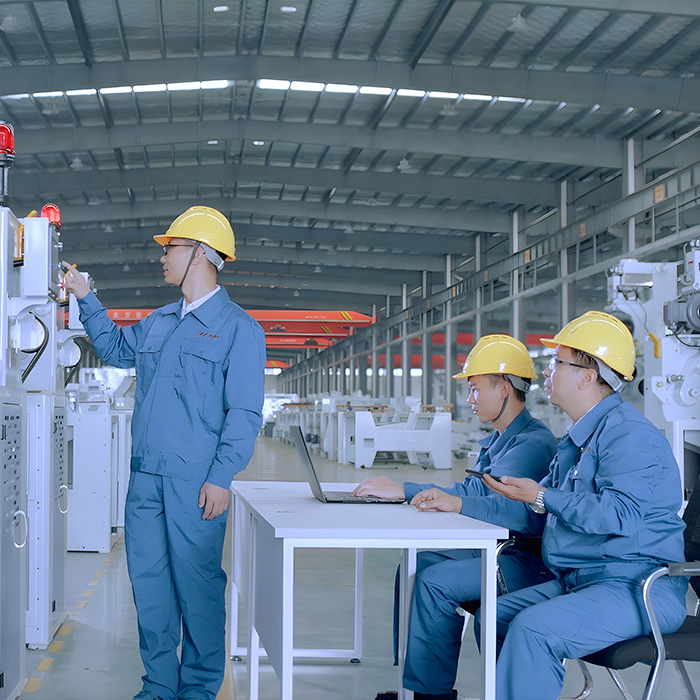 Engineers inspecting grain processing equipment
